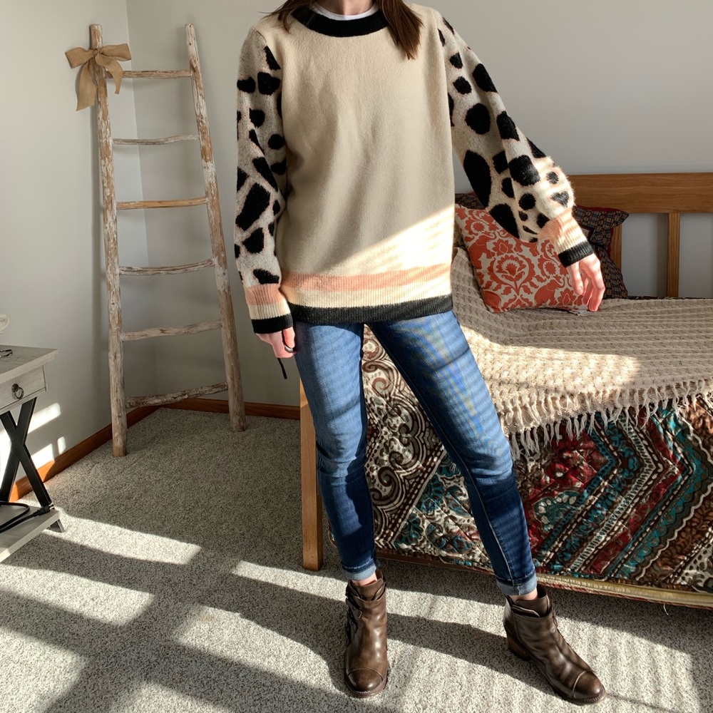 Entro cream sweater with cow print sleeves